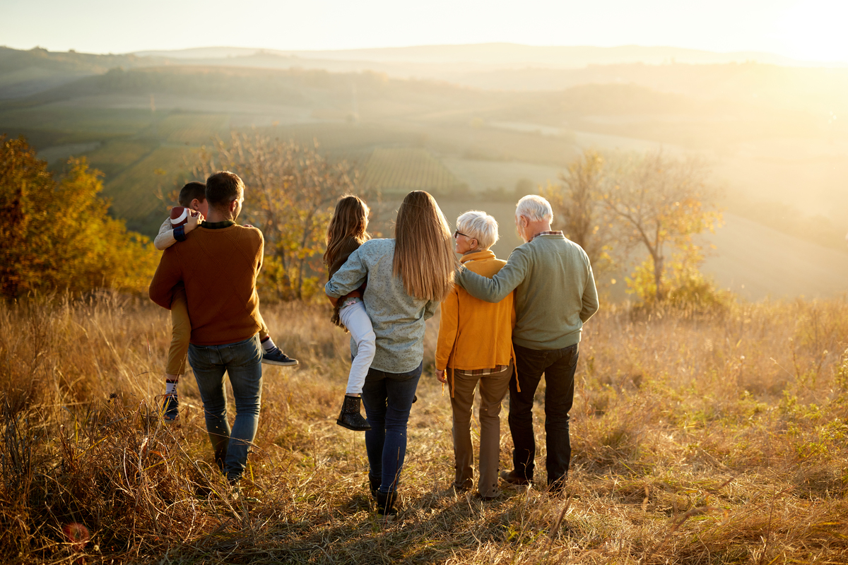 Family walking together at sunset